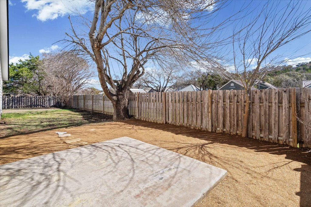 303 Fantail Loop, Unit A Austin, TX 78734 - Photo 23 of 28 a view of a backyard of the house