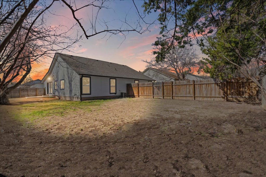 303 Fantail Loop, Unit A Austin, TX 78734 - Photo 25 of 28 a view of a house with a yard