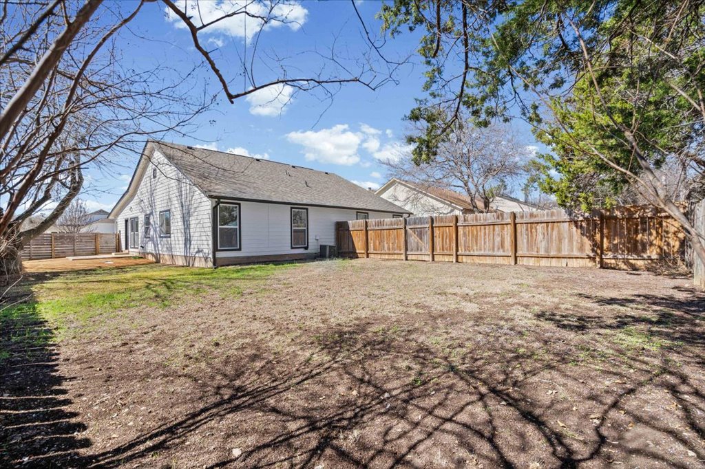 303 Fantail Loop, Unit A Austin, TX 78734 - Photo 26 of 28 a view of a house with a yard
