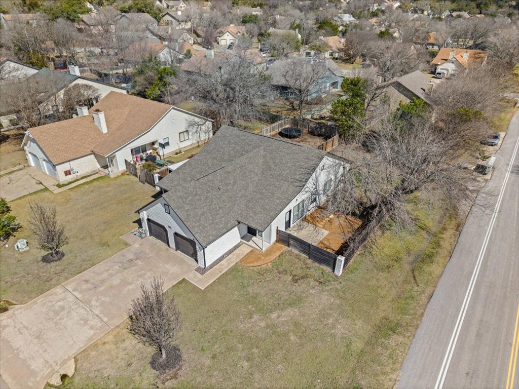 303 Fantail Loop, Unit A Austin, TX 78734 - Photo 27 of 28 an aerial view of a house with a yard and trees