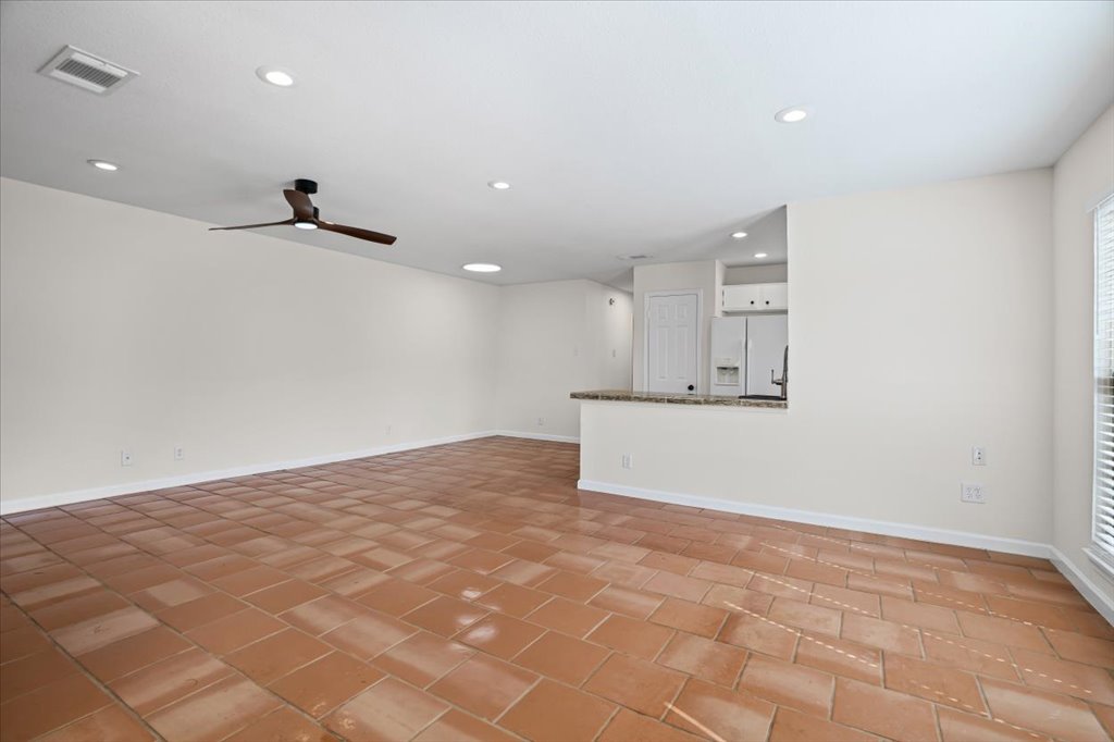 303 Fantail Loop, Unit A Austin, TX 78734 - Photo 4 of 28 a view of a kitchen with a sink and cabinets