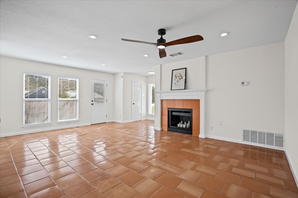 303 Fantail Loop, Unit A Austin, TX 78734 - Photo 7 of 28 a view of a livingroom with a fireplace and window
