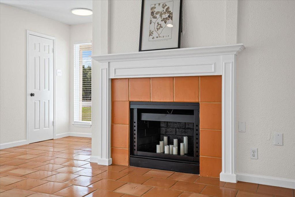 303 Fantail Loop, Unit A Austin, TX 78734 - Photo 8 of 28 a living room with a fireplace