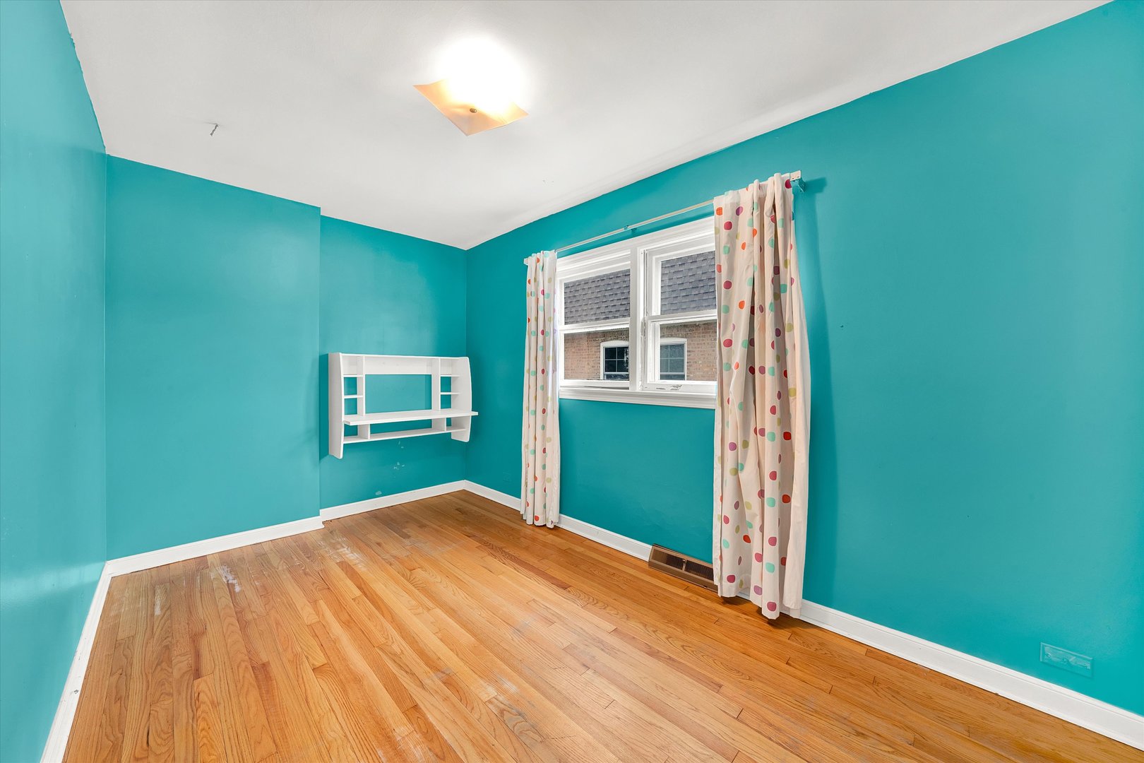 3933 West 58th Street Chicago, IL 60629 - Photo 12 of 32 a bedroom with a bed and a window