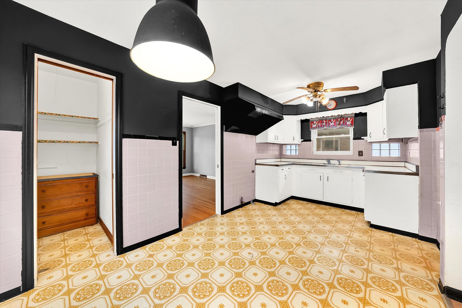 3933 West 58th Street Chicago, IL 60629 - Photo 19 of 32 a view of kitchen with cabinets and window