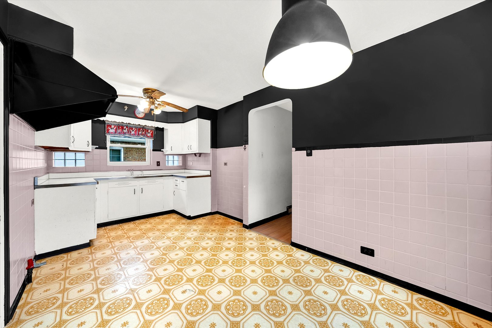 3933 West 58th Street Chicago, IL 60629 - Photo 20 of 32 a kitchen with a sink appliances and cabinets