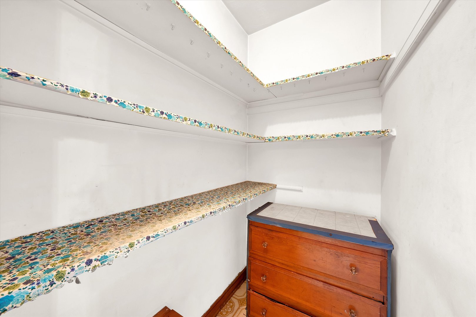 3933 West 58th Street Chicago, IL 60629 - Photo 22 of 32 a view of a room with racks on the wall