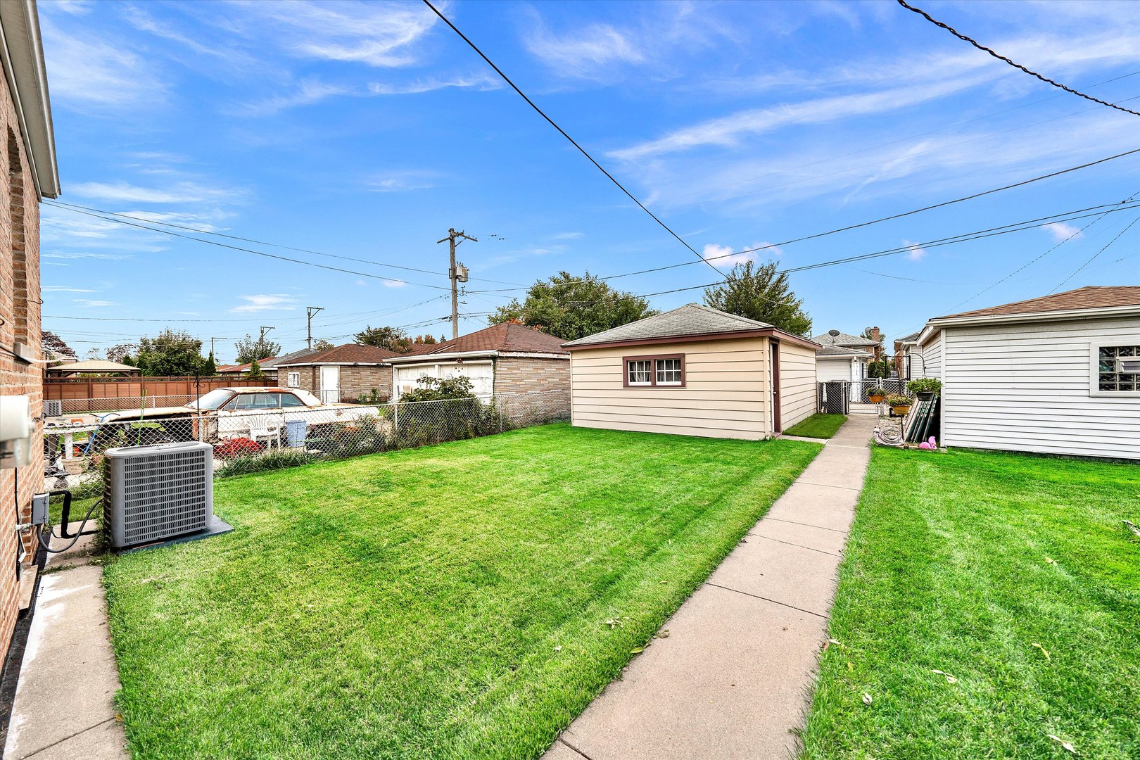 3933 West 58th Street Chicago, IL 60629 - Photo 28 of 32 a view of a backyard with sitting area
