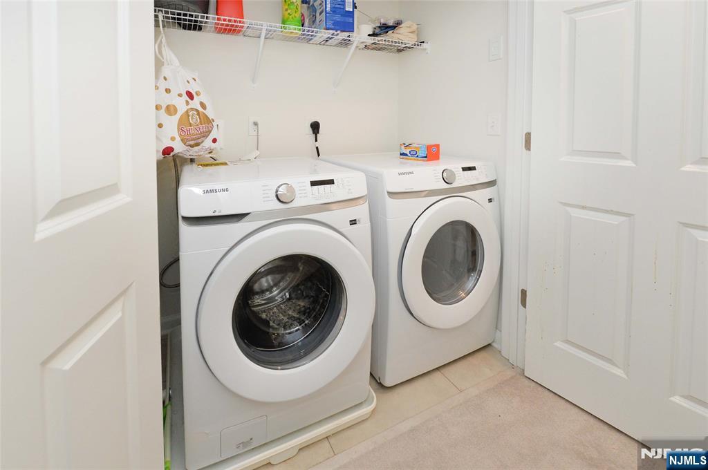 12-48 Plaza Road Fair Lawn, NJ 07410 - Photo 19 of 26 a utility room with dryer and washer