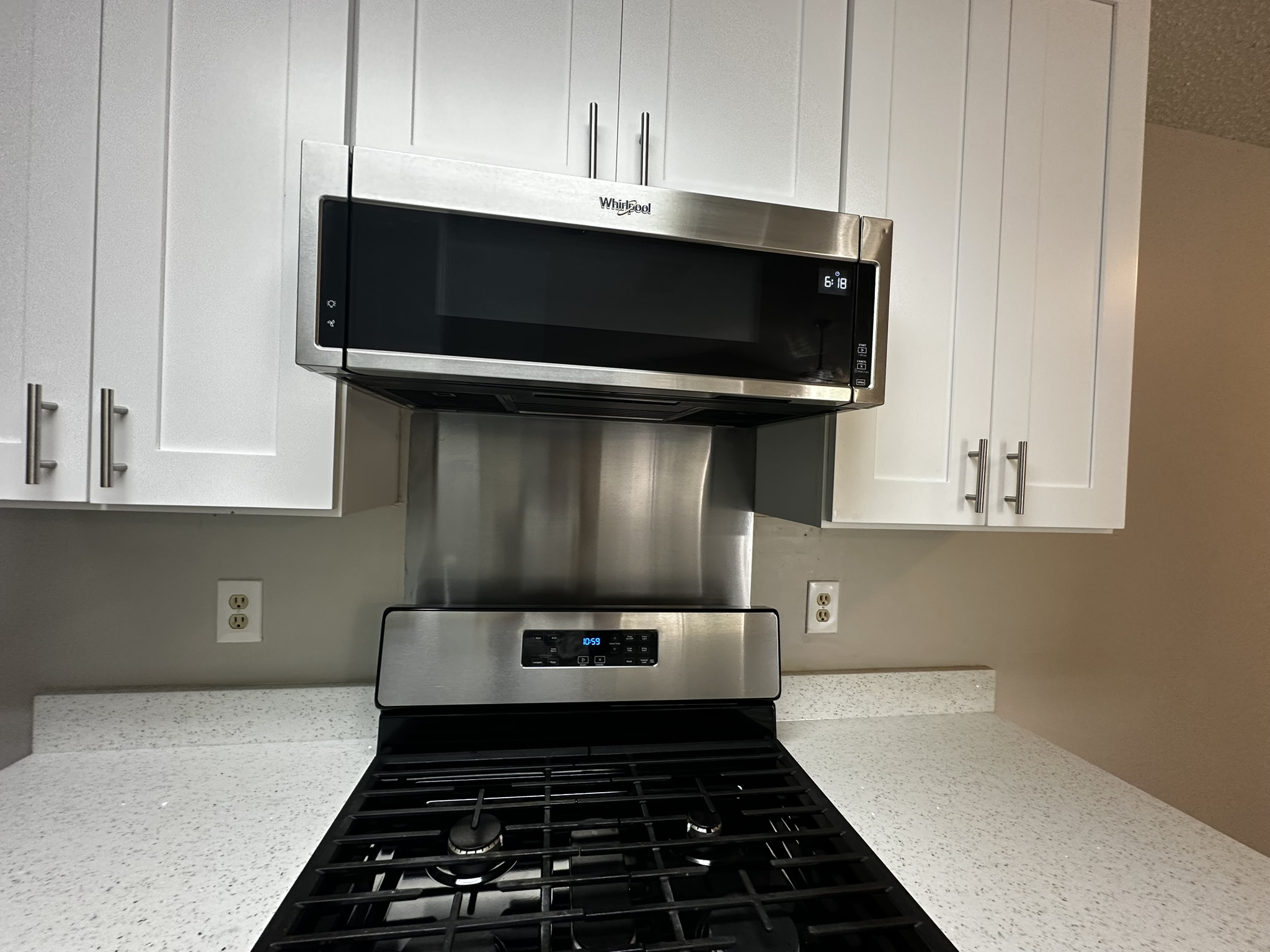 7900 West Gate Boulevard, Unit B Austin, TX 78745 - Photo 5 of 16 A contemporary kitchen features sleek white cabinetry paired with durable quartz countertops.