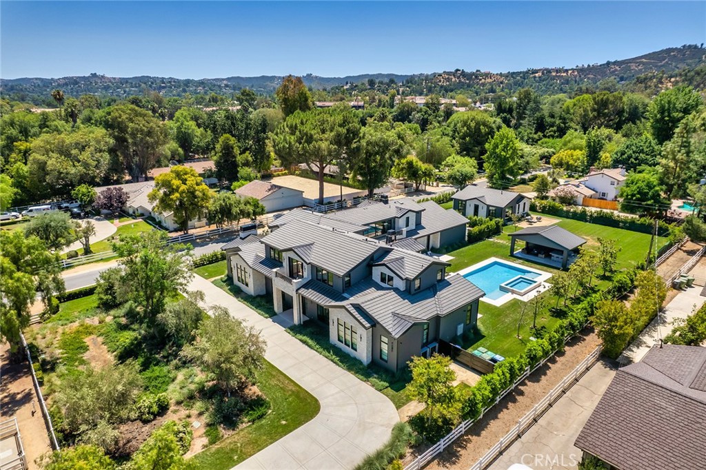 an aerial view of a house with a garden
