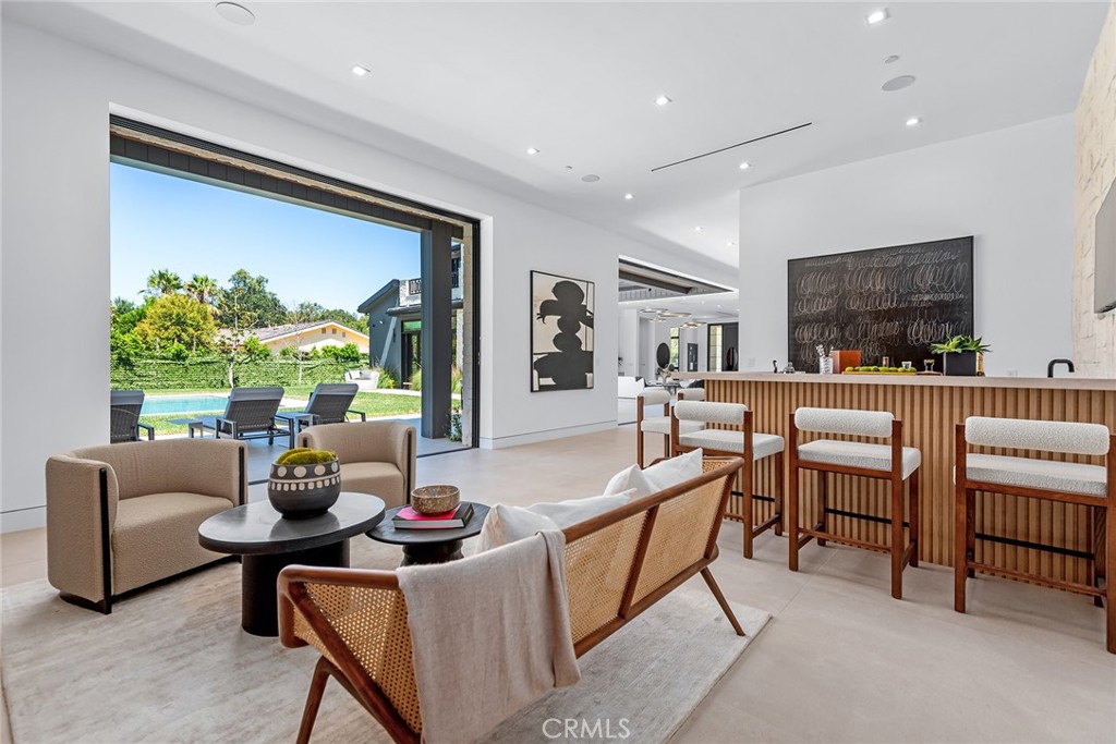 23650 Long Valley Road Hidden Hills, CA 91302 - Photo 19 of 57 a living room with furniture and a large window