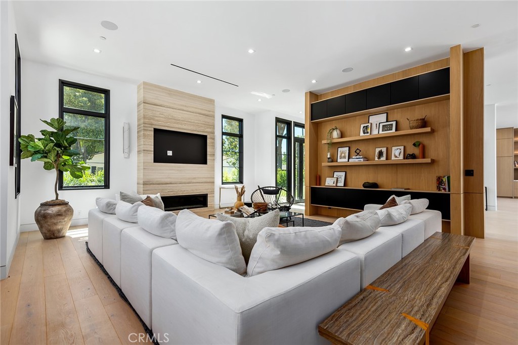 23650 Long Valley Road Hidden Hills, CA 91302 - Photo 21 of 57 a living room with furniture fireplace and a flat screen tv