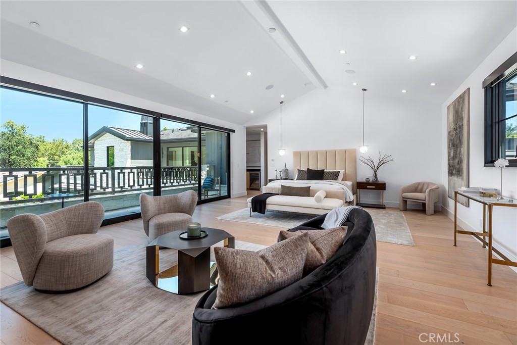23650 Long Valley Road Hidden Hills, CA 91302 - Photo 29 of 57 a living room with furniture fireplace and a large window