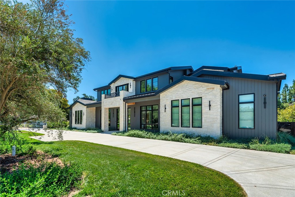 23650 Long Valley Road Hidden Hills, CA 91302 - Photo 3 of 57 front view of a house with a garden