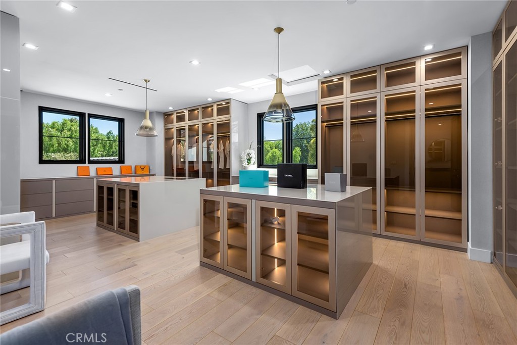 23650 Long Valley Road Hidden Hills, CA 91302 - Photo 32 of 57 a kitchen with stainless steel appliances granite countertop a stove and a refrigerator