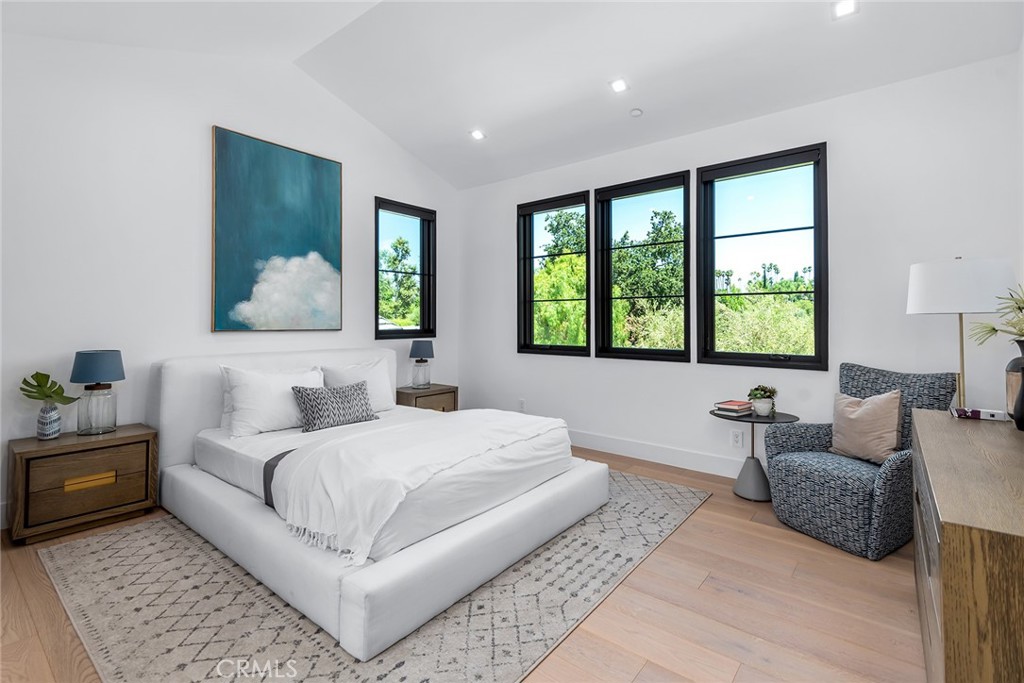 23650 Long Valley Road Hidden Hills, CA 91302 - Photo 34 of 57 a bedroom with a large bed couch and a window