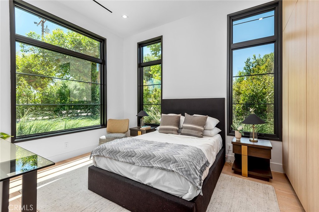 23650 Long Valley Road Hidden Hills, CA 91302 - Photo 42 of 57 a bedroom with a bed and a large window