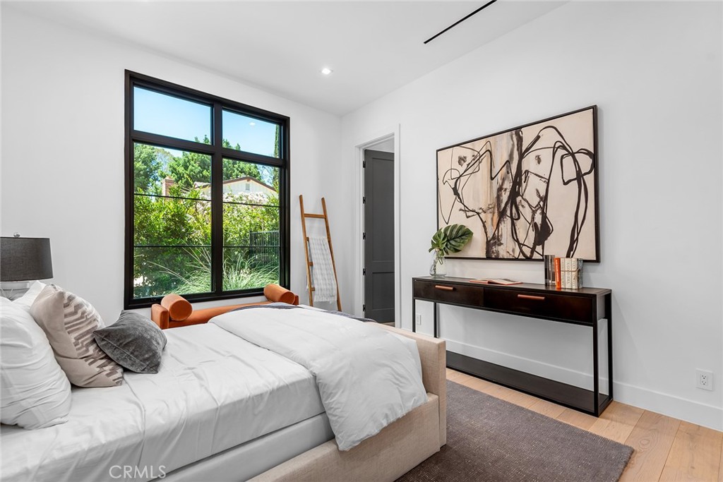 23650 Long Valley Road Hidden Hills, CA 91302 - Photo 44 of 57 a bedroom with a bed and a window