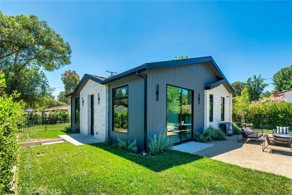 23650 Long Valley Road Hidden Hills, CA 91302 - Photo 46 of 57 a view of a house with backyard porch and sitting area