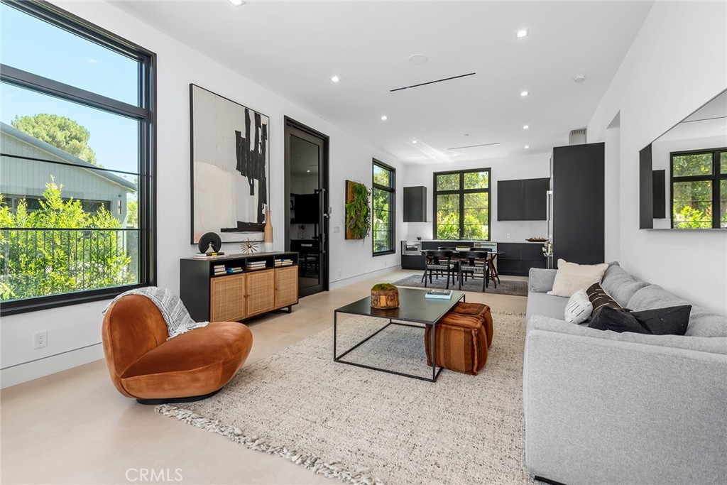 23650 Long Valley Road Hidden Hills, CA 91302 - Photo 48 of 57 a living room with furniture a rug and a large window