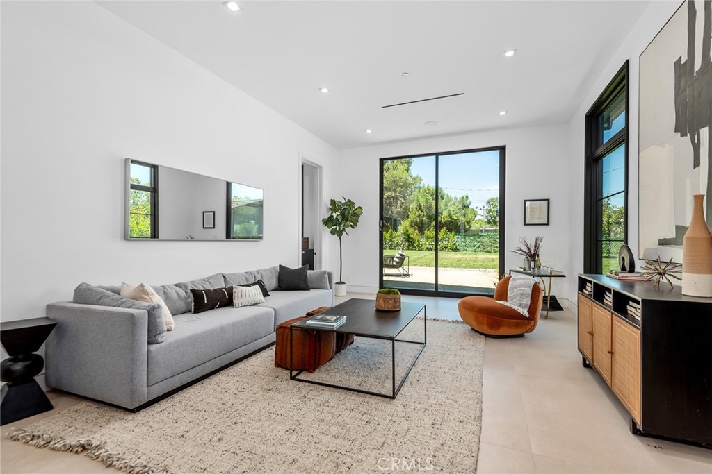 23650 Long Valley Road Hidden Hills, CA 91302 - Photo 49 of 57 a living room with furniture and a large window
