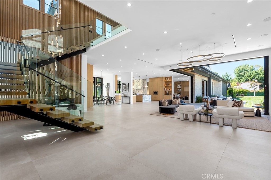 23650 Long Valley Road Hidden Hills, CA 91302 - Photo 5 of 57 a view of a livingroom with furniture and a floor to ceiling window
