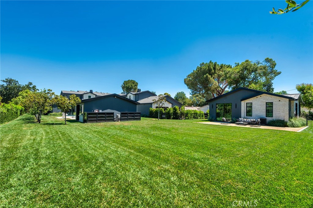 23650 Long Valley Road Hidden Hills, CA 91302 - Photo 54 of 57 a front view of a house with a garden