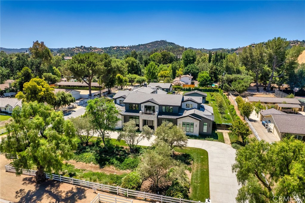23650 Long Valley Road Hidden Hills, CA 91302 - Photo 57 of 57 a view of a city with lush green forest