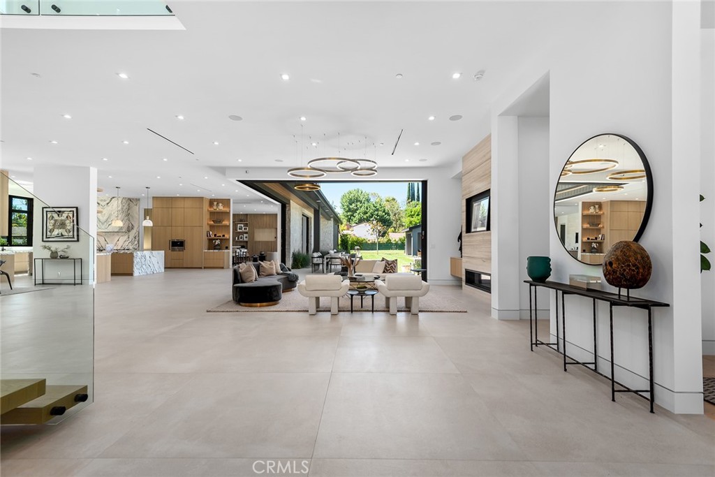 23650 Long Valley Road Hidden Hills, CA 91302 - Photo 7 of 57 a living room with furniture and a large window