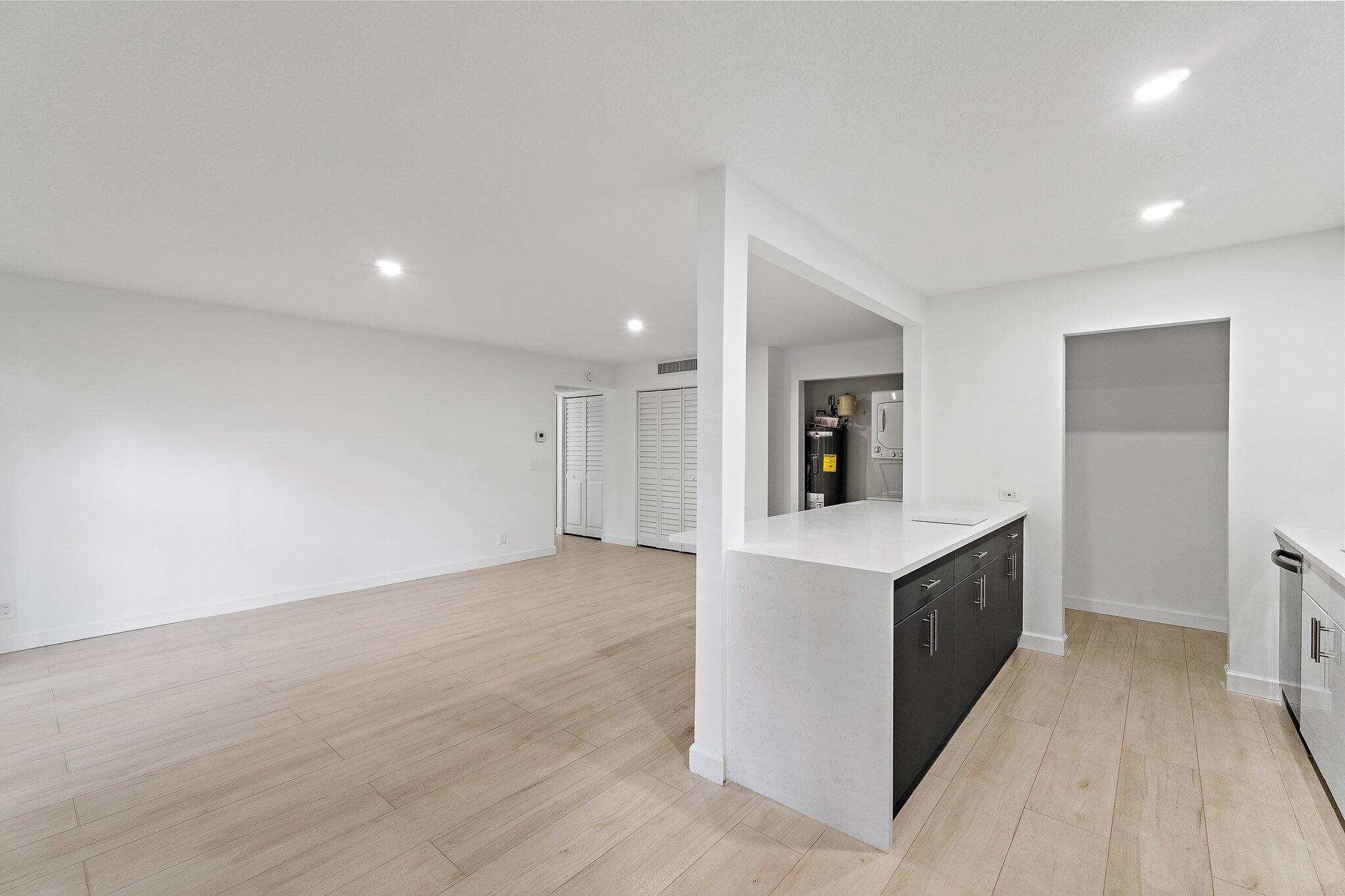 150 Pineview Road, Unit I4 Jupiter, FL 33469 - Photo 5 of 13 a view of kitchen with sink and refrigerator