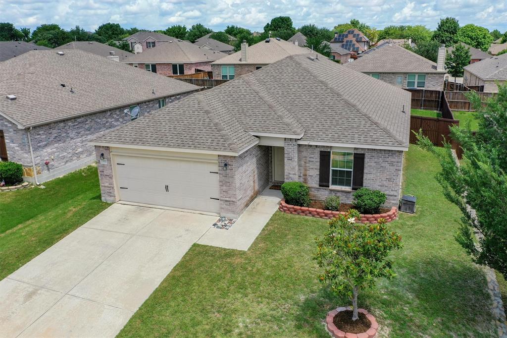 Single-story residence featuring a brick exterior and a two-car garage