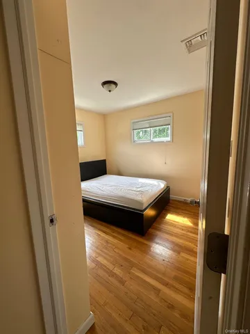 a bedroom with a bed and a table