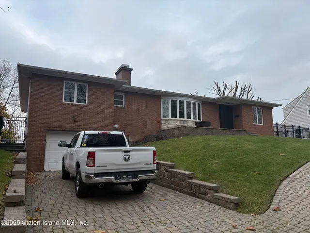 a house view with a garden space