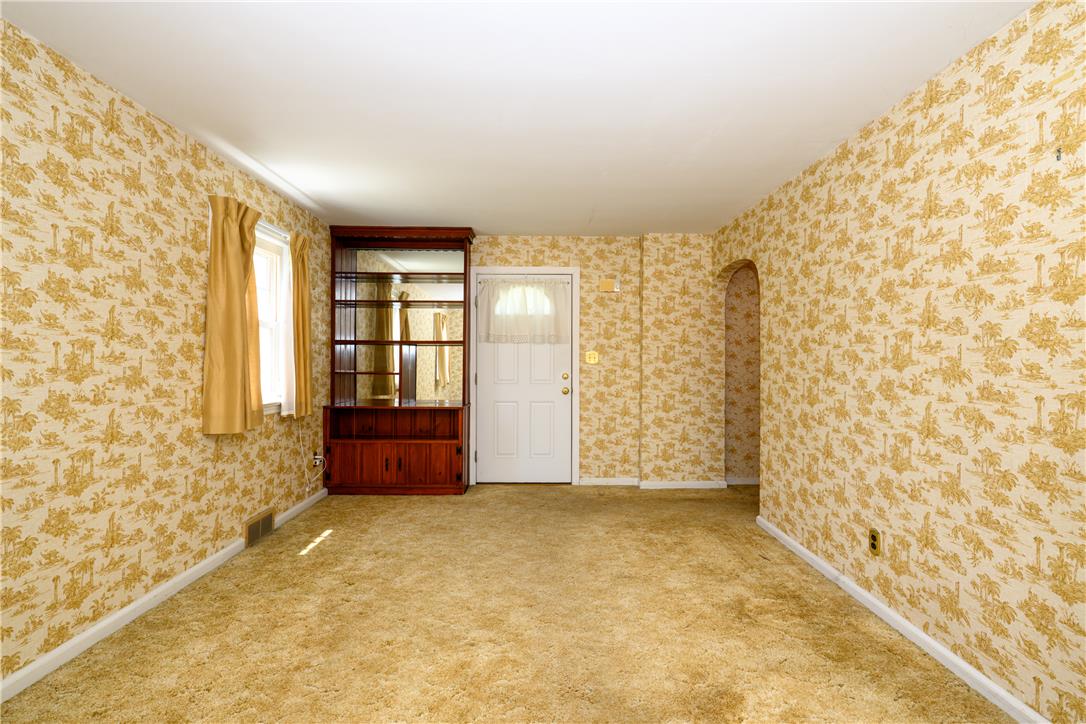 2270 Rodgers Street Bethlehem, PA 18017 - Photo 3 of 24 This living area features a patterned wallpaper and soft carpet, ready for your personal touch.