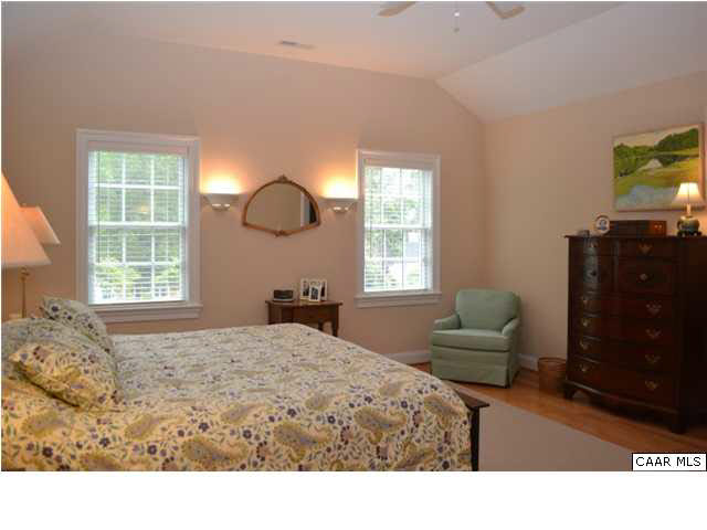 1715 Meadowbrook Heights Road Charlottesville, VA 22901 - Photo 11 of 23 Spacious master bedroom in new wing with 10' ceiling, hardwood floors and two walk-in closets, each of which has extra storage areas. There is also a separate seating area.