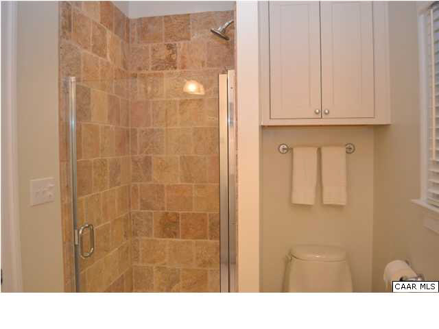 1715 Meadowbrook Heights Road Charlottesville, VA 22901 - Photo 17 of 23 Travertine tiled shower in this bathroom.