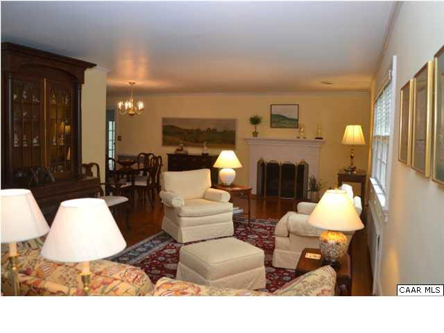1715 Meadowbrook Heights Road Charlottesville, VA 22901 - Photo 3 of 23 Comfortable formal living room with beautiful hardwood floors, crown molding, triple window and gas fireplace. 30' length allows great flexibility in furniture arranging.