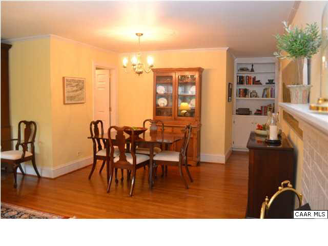 1715 Meadowbrook Heights Road Charlottesville, VA 22901 - Photo 5 of 23 Adjoining dining room with hardwood floors, crown molding and built-in shelving and cabinetry.