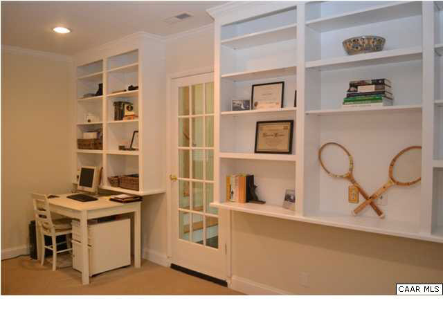 1715 Meadowbrook Heights Road Charlottesville, VA 22901 - Photo 9 of 23 First floor office has these many built-ins. 16x9 allows for various furniture arrangements. Access is from the breezeway as well as garage and direct from the outside- very versatile. A half bath with Corian sink is here.