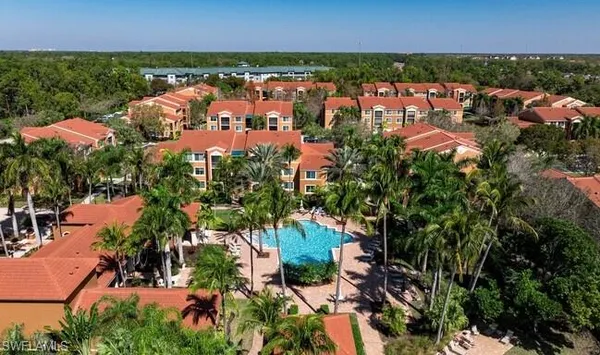 an aerial view of city and lake