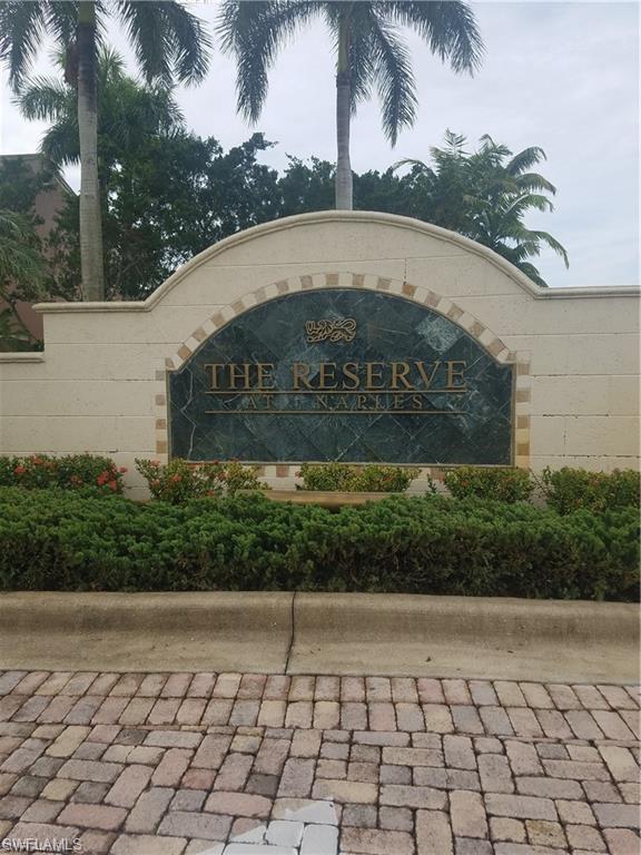 1200 Reserve Way, Unit 201 Naples, FL 34105 - Photo 15 of 20 a sign on the side of a building