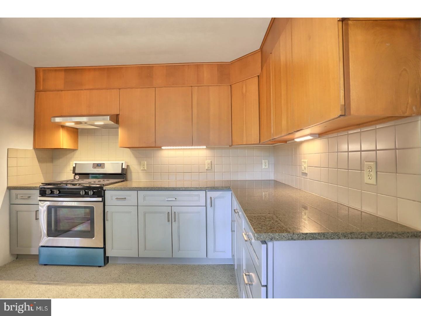 1716 Hill Road Reading, PA 19602 - Photo 11 of 24 a kitchen with granite countertop a sink stove and cabinets