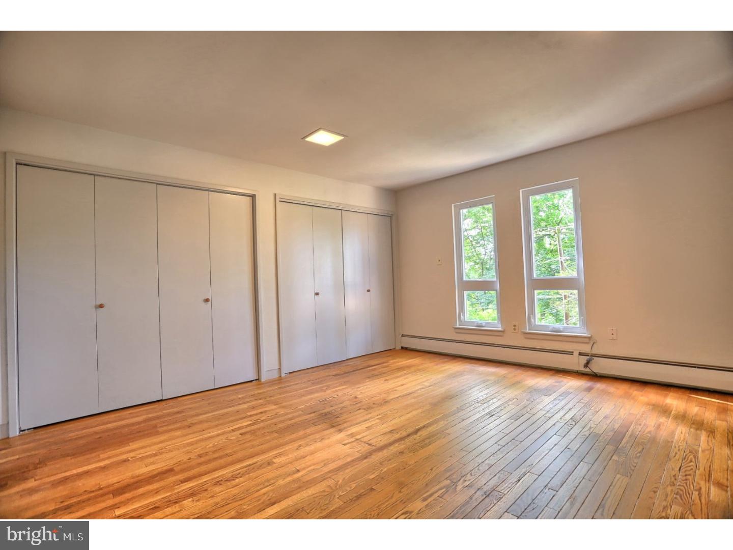 1716 Hill Road Reading, PA 19602 - Photo 13 of 24 a view of an empty room with wooden floor and a window