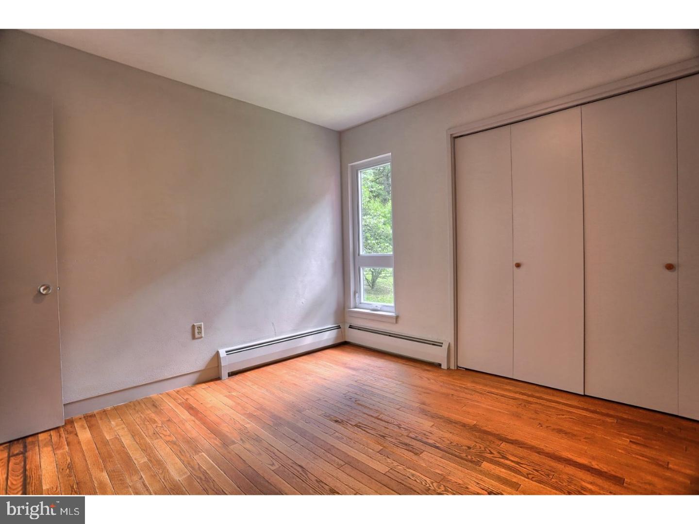 1716 Hill Road Reading, PA 19602 - Photo 16 of 24 wooden floor in an empty room with a window