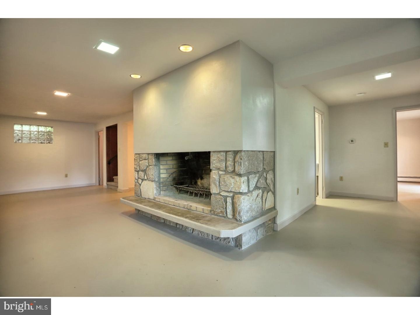1716 Hill Road Reading, PA 19602 - Photo 18 of 24 a living room with a fireplace and a projector