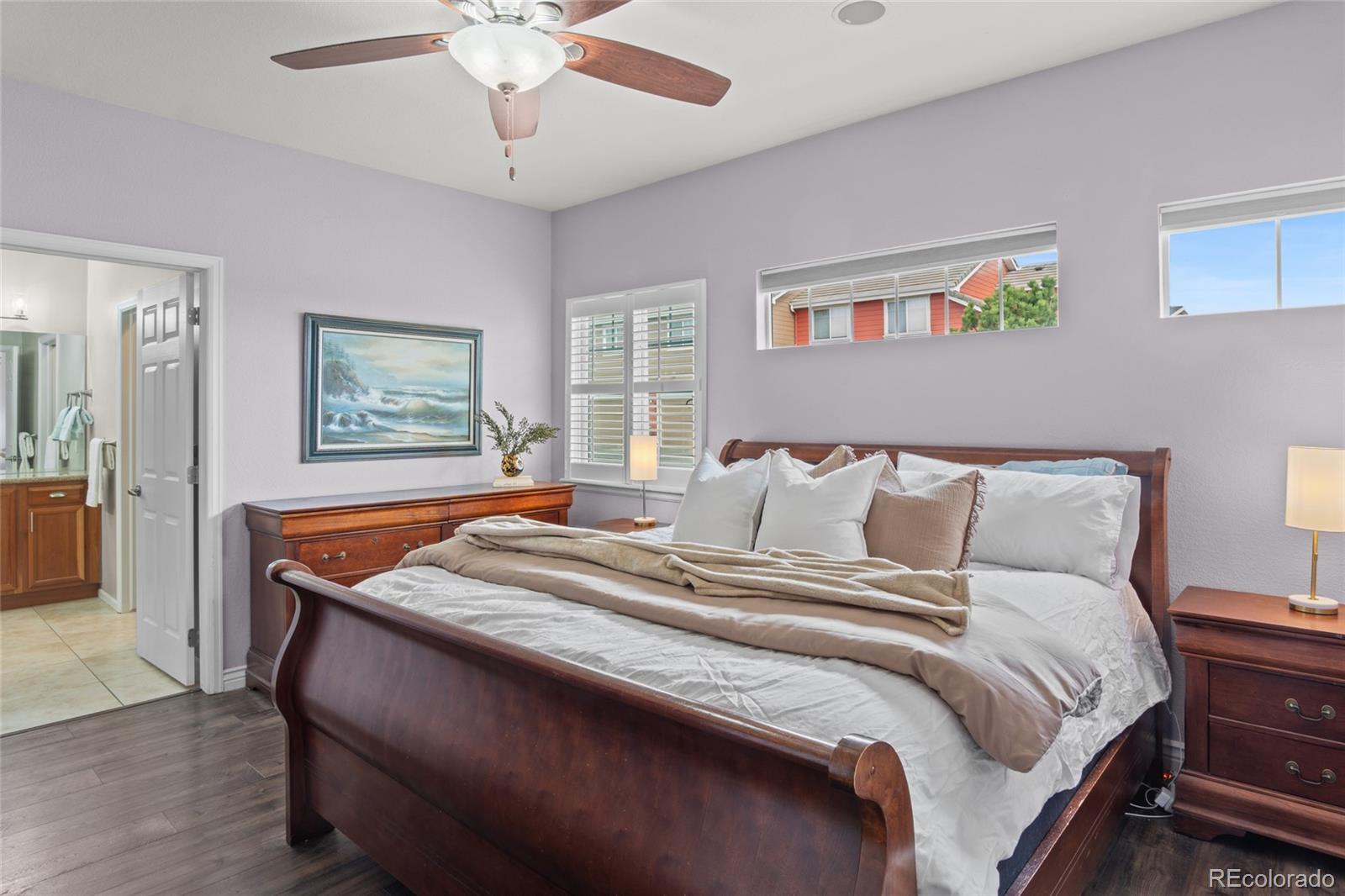 10550 Paris Street, Unit 705 Henderson, CO 80640 - Photo 12 of 30 a bedroom with bed and a chandelier
