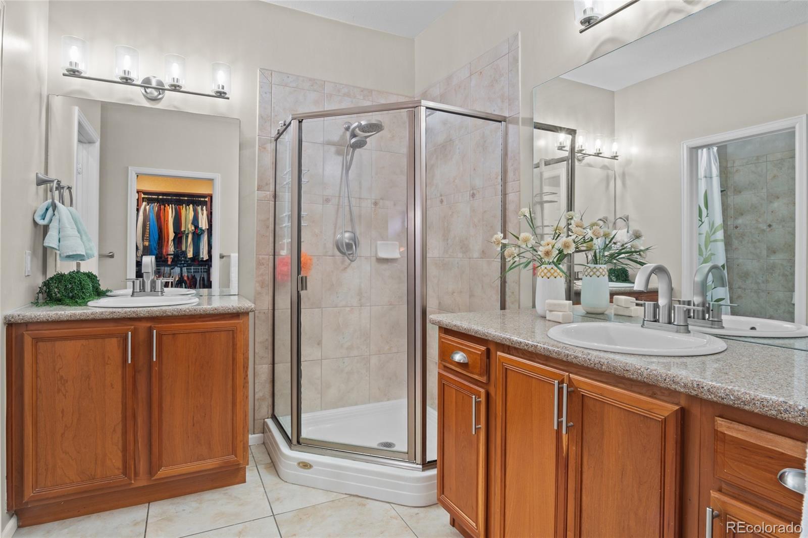 10550 Paris Street, Unit 705 Henderson, CO 80640 - Photo 14 of 30 a bathroom with a granite countertop sink and a mirror