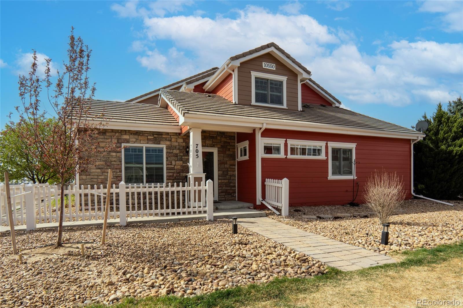 10550 Paris Street, Unit 705 Henderson, CO 80640 - Photo 27 of 30 a front view of a house with a yard