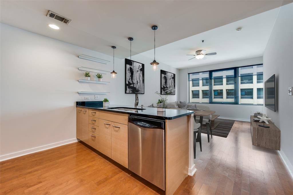 a kitchen with stainless steel appliances granite countertop a stove and a sink